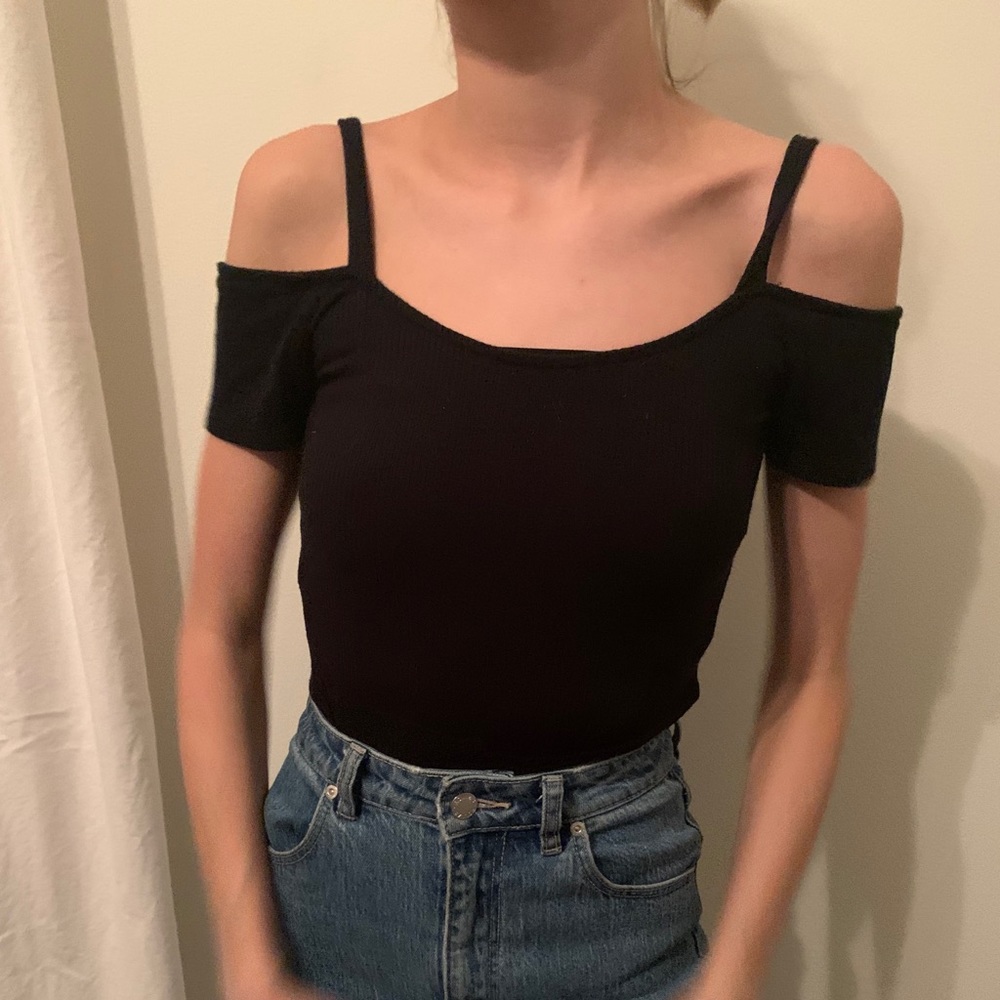 Out from under black ribbed body suit